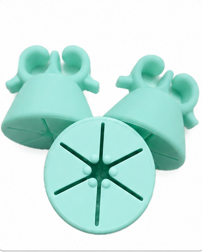 Five pairs of silicone kitchen utensils shown in different colors on a white background: two black, two yellow, two pink, two mint green, and two blue. Each set includes bell-shaped pieces and round star-shaped pieces.